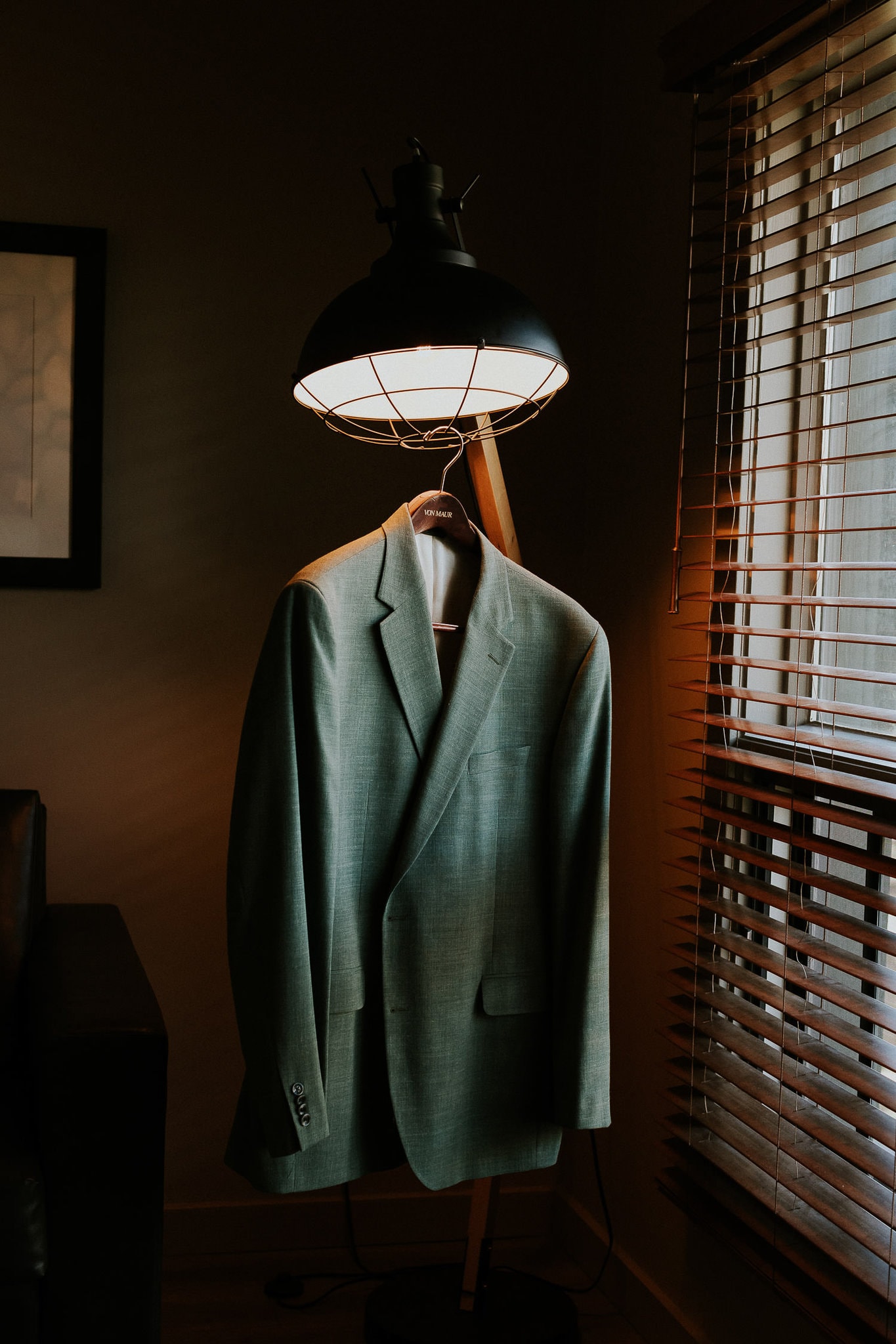 mint green suit hanging from a light at buffalo mountain lodge