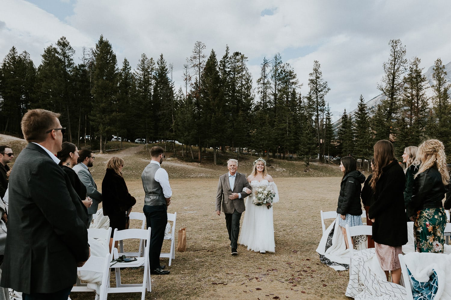 bride coming down the aisle at her outdoor wedding in Banff